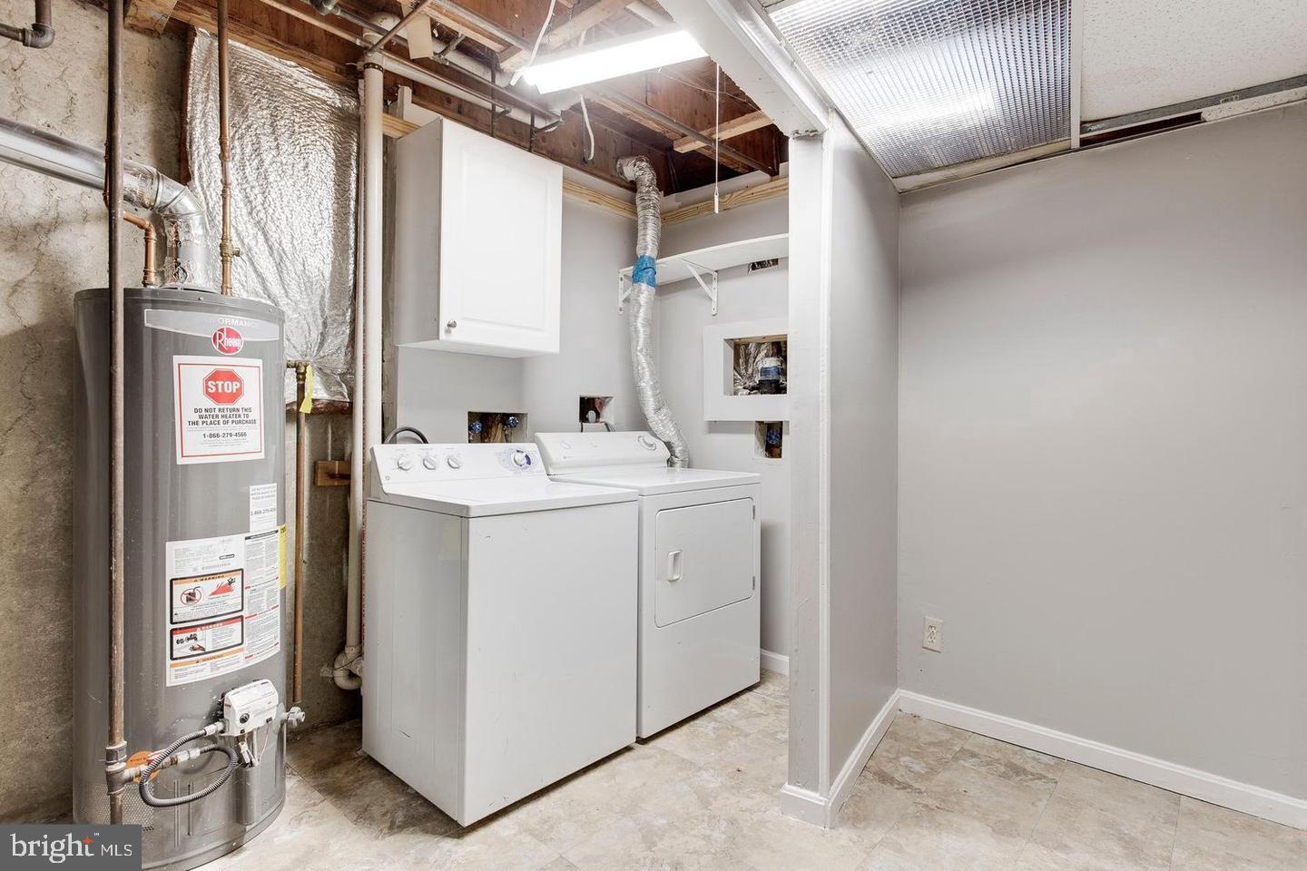 304 Crescendo Way Silver Spring, MD 20901 - Photo 27 of 29 a utility room with dryer and washer