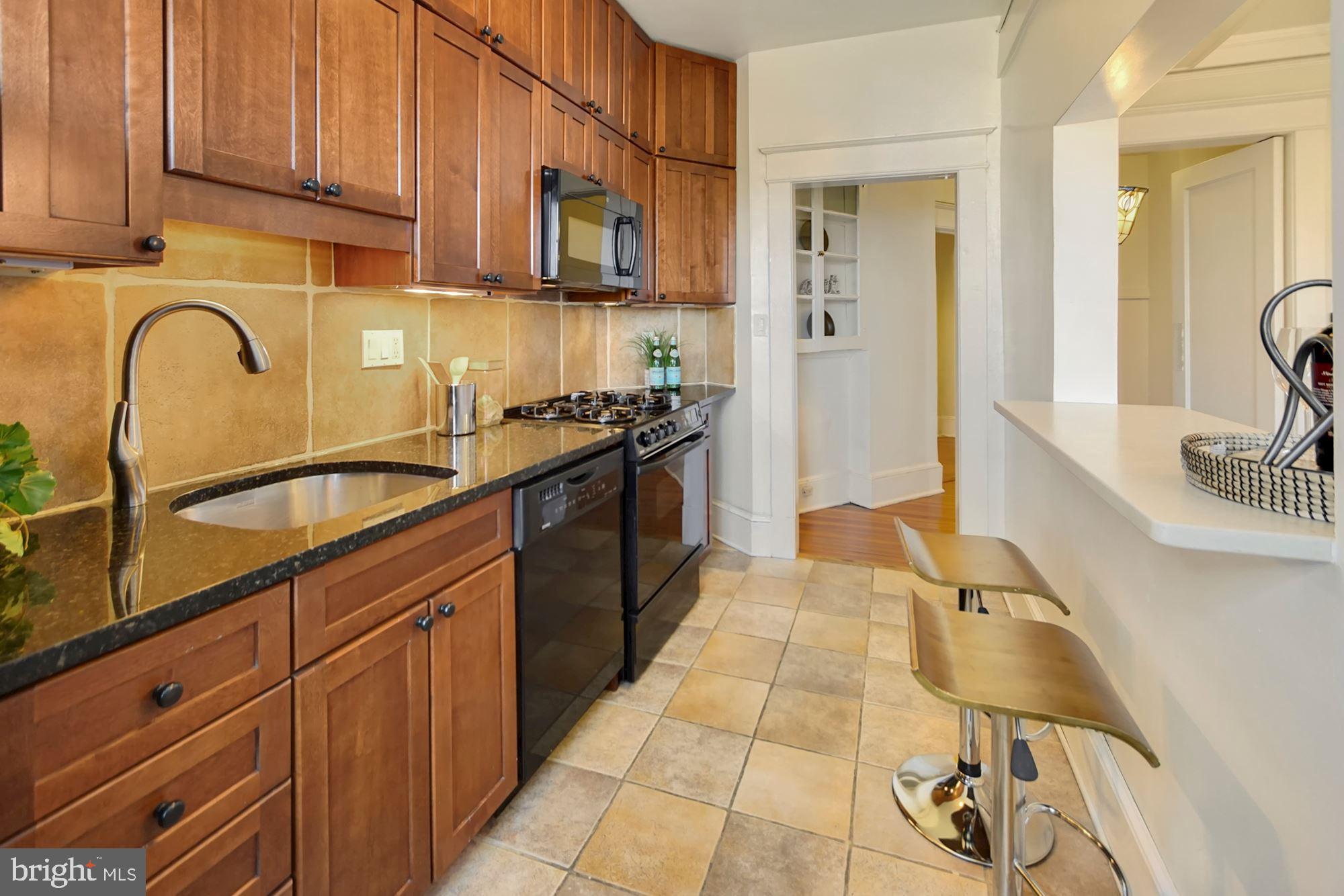1736 Columbia Road Northwest, Unit 311 Washington, DC 20009 - Photo 14 of 34 granite counters and cherry cabinets