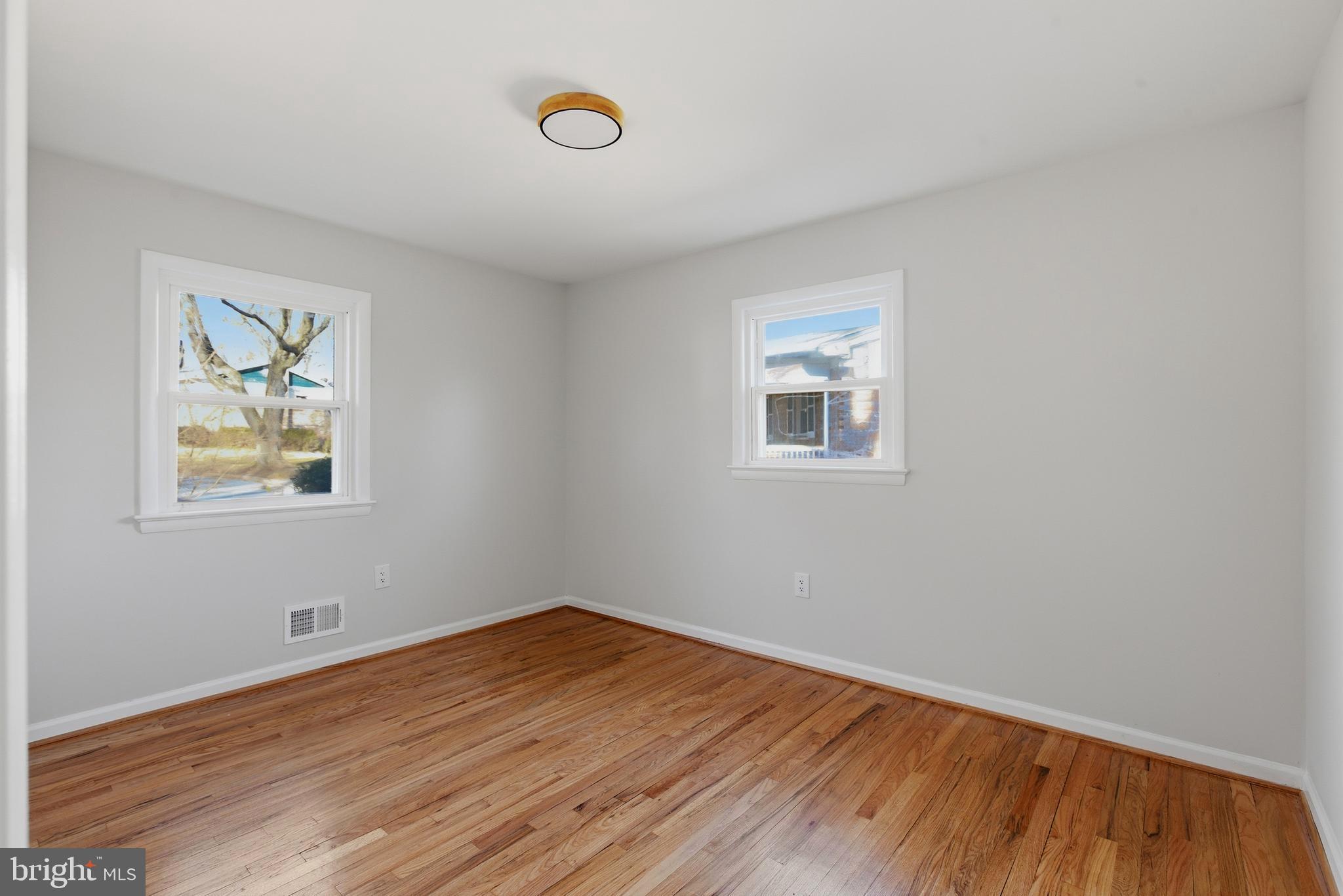 709 Quarry Avenue Capitol Heights, MD 20743 - Photo 17 of 43 a view of empty room with wooden floor and fan
