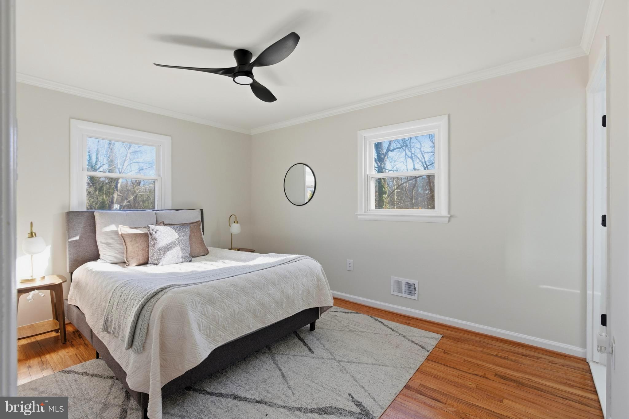 709 Quarry Avenue Capitol Heights, MD 20743 - Photo 20 of 43 a bedroom with a bed and wooden floor