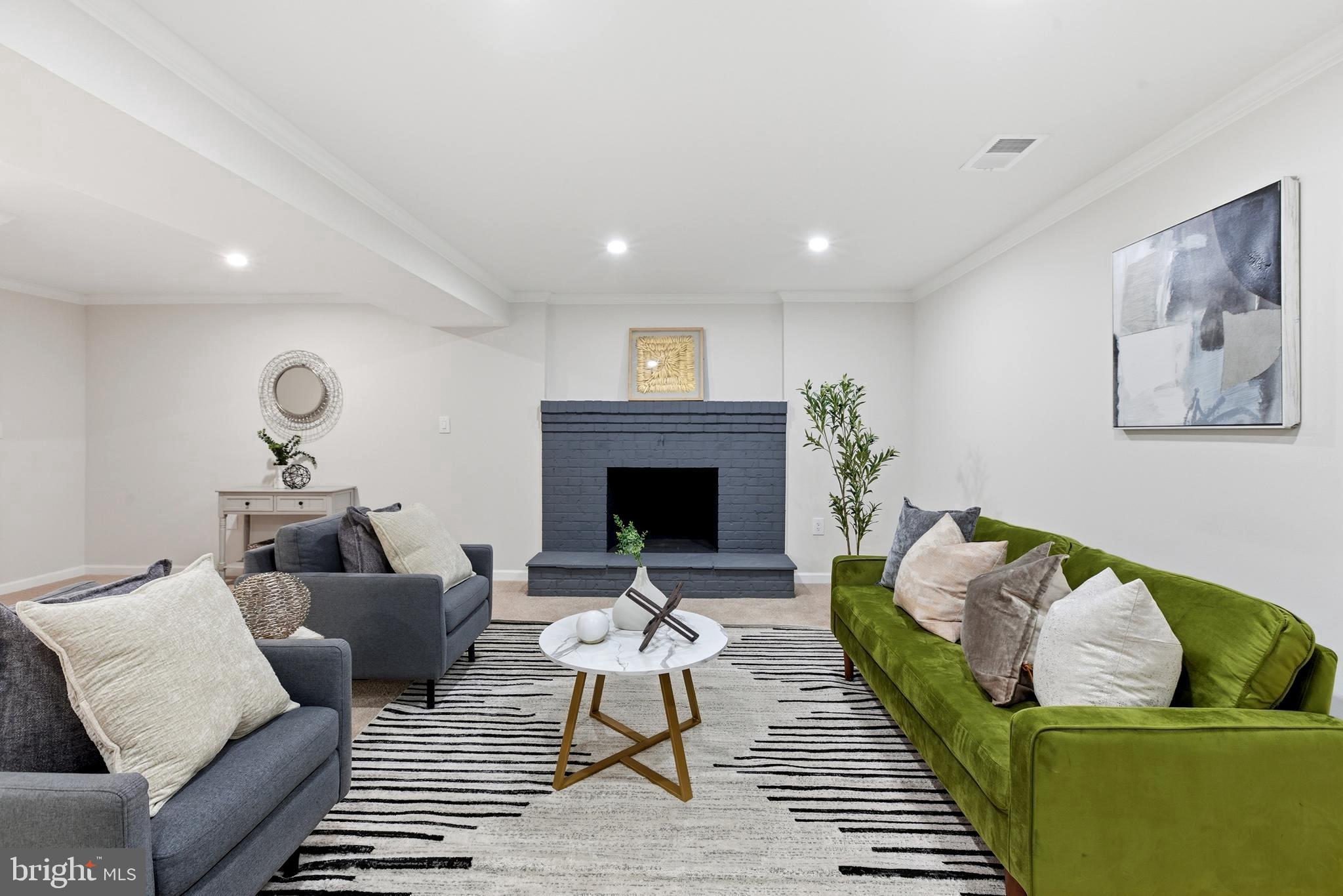 709 Quarry Avenue Capitol Heights, MD 20743 - Photo 26 of 43 a living room with furniture and a fireplace