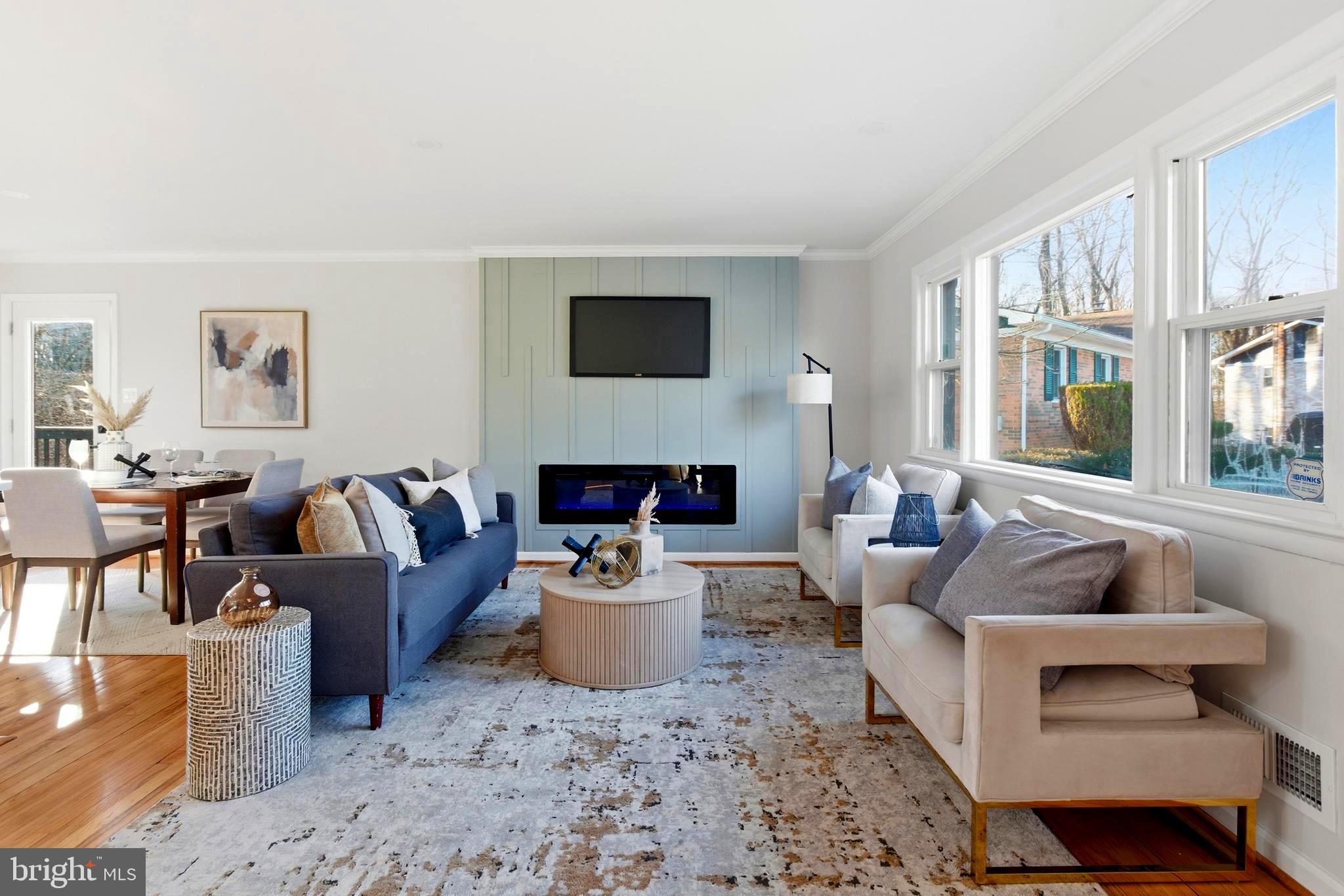 709 Quarry Avenue Capitol Heights, MD 20743 - Photo 3 of 43 a living room with furniture a rug and a fireplace
