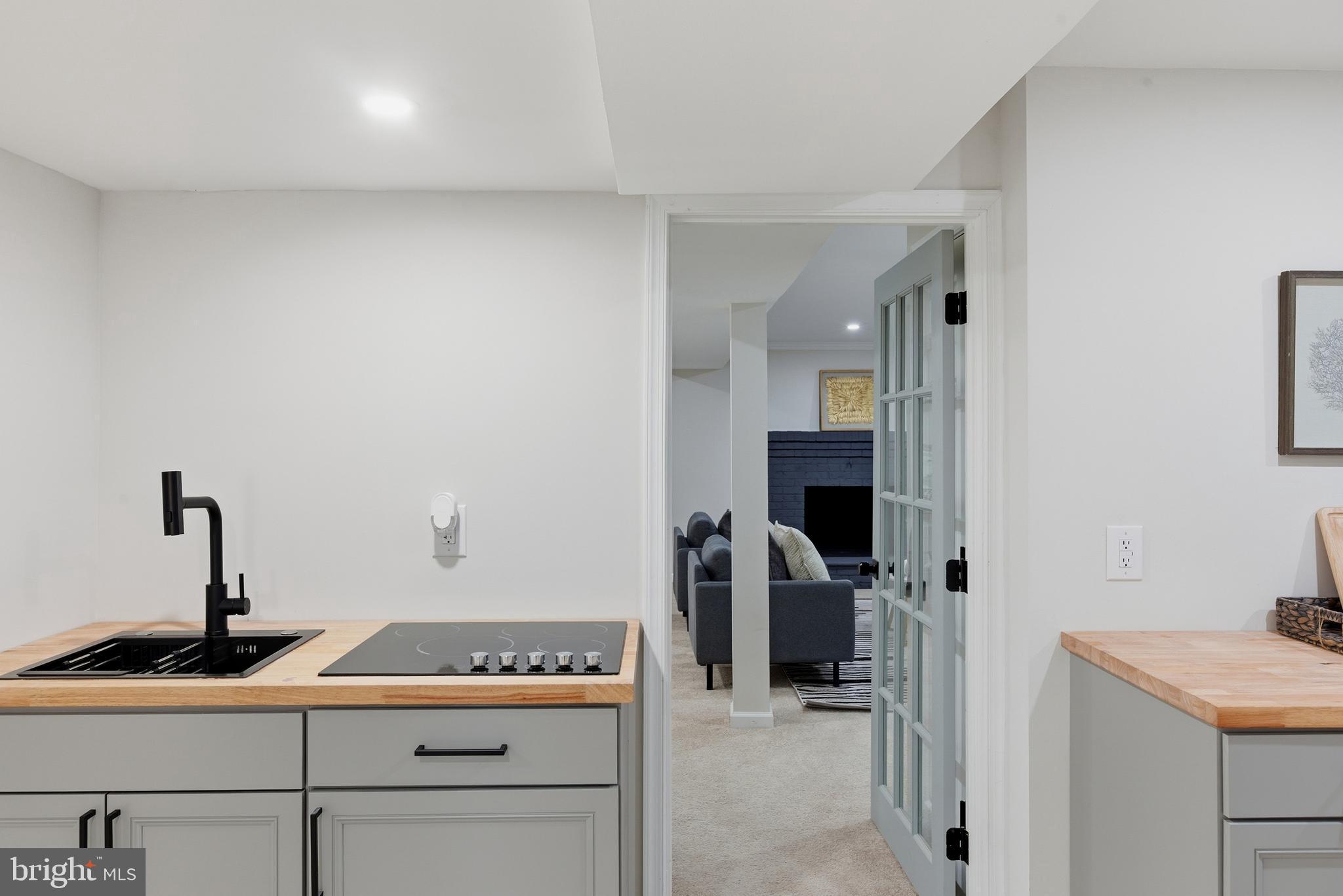 709 Quarry Avenue Capitol Heights, MD 20743 - Photo 32 of 43 a kitchen with a sink and cabinets