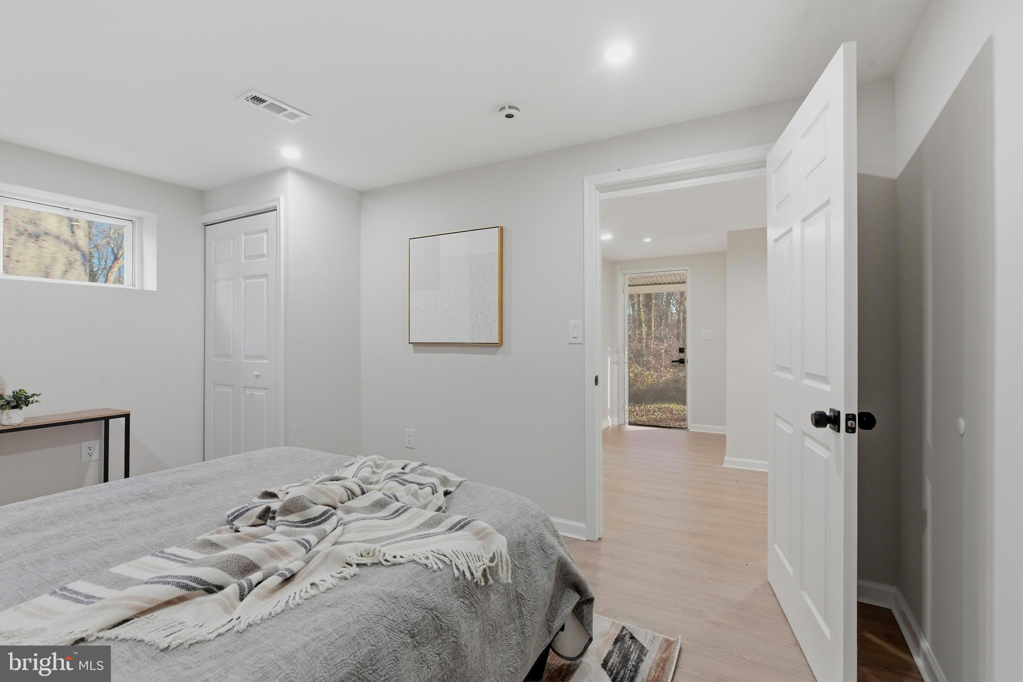 709 Quarry Avenue Capitol Heights, MD 20743 - Photo 34 of 43 a bedroom with a bed and a chandelier