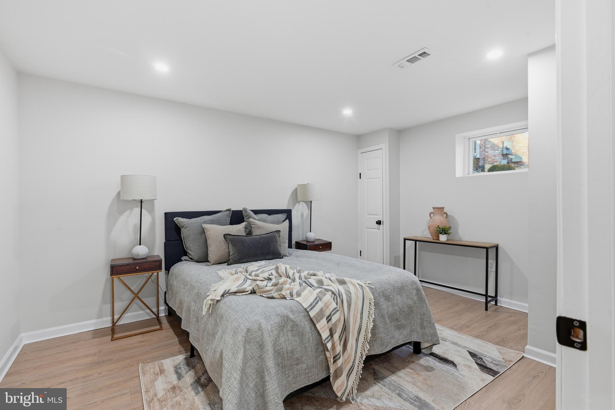 709 Quarry Avenue Capitol Heights, MD 20743 - Photo 35 of 43 a bedroom with a bed and wooden floor