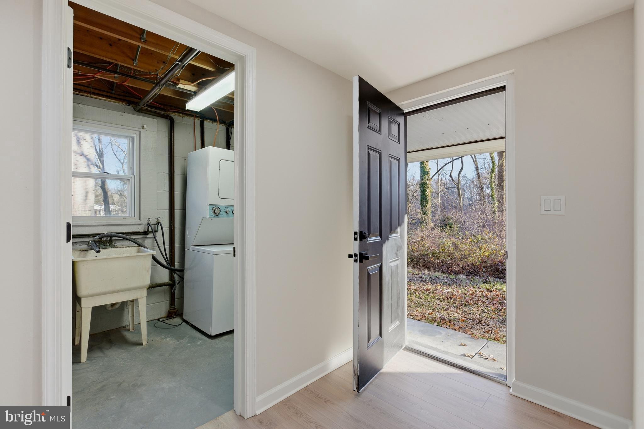 709 Quarry Avenue Capitol Heights, MD 20743 - Photo 38 of 43 a view of a hallway and a livingroom with wooden floor and a refrigerator