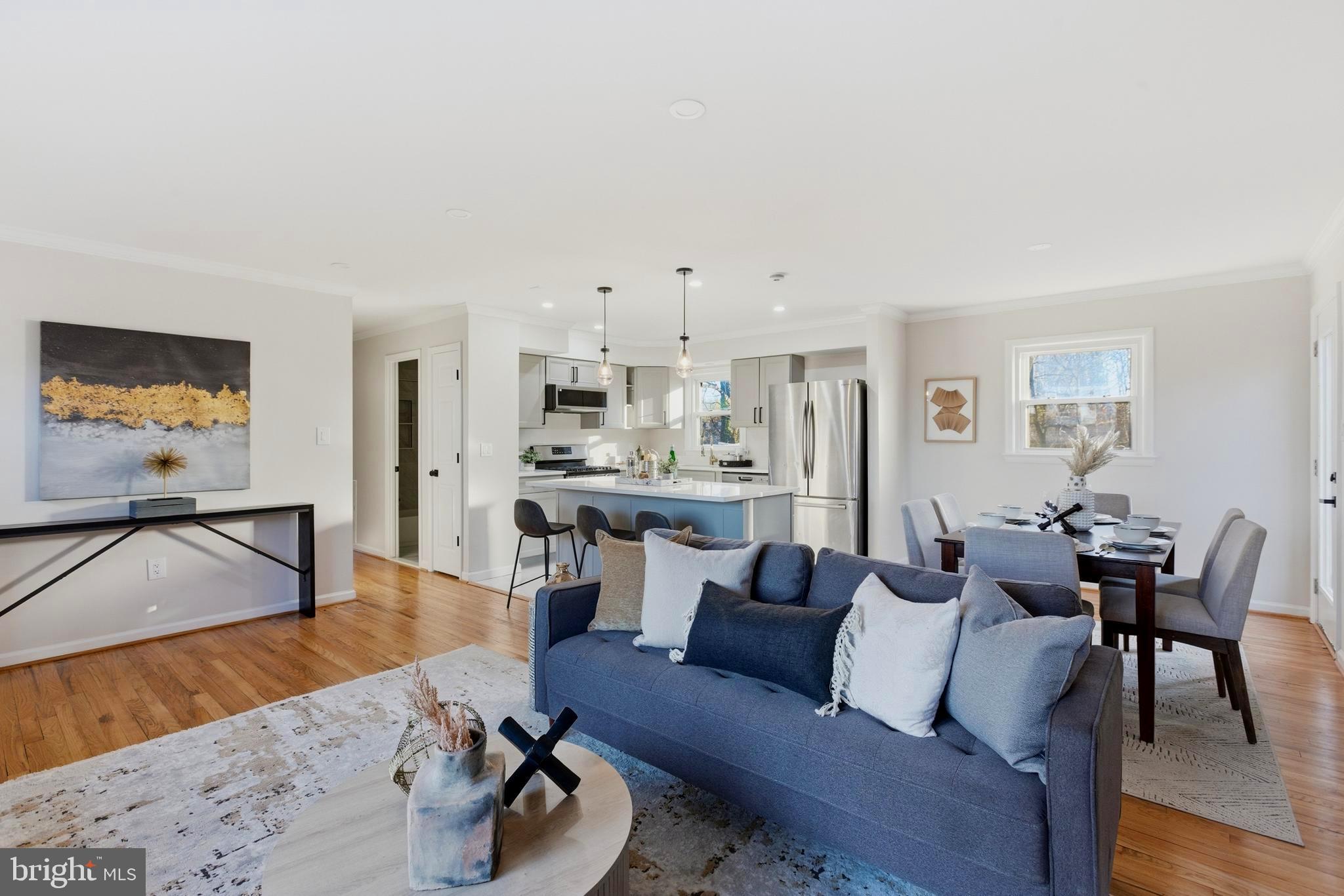 709 Quarry Avenue Capitol Heights, MD 20743 - Photo 5 of 43 a living room with furniture and a flat screen tv with kitchen view