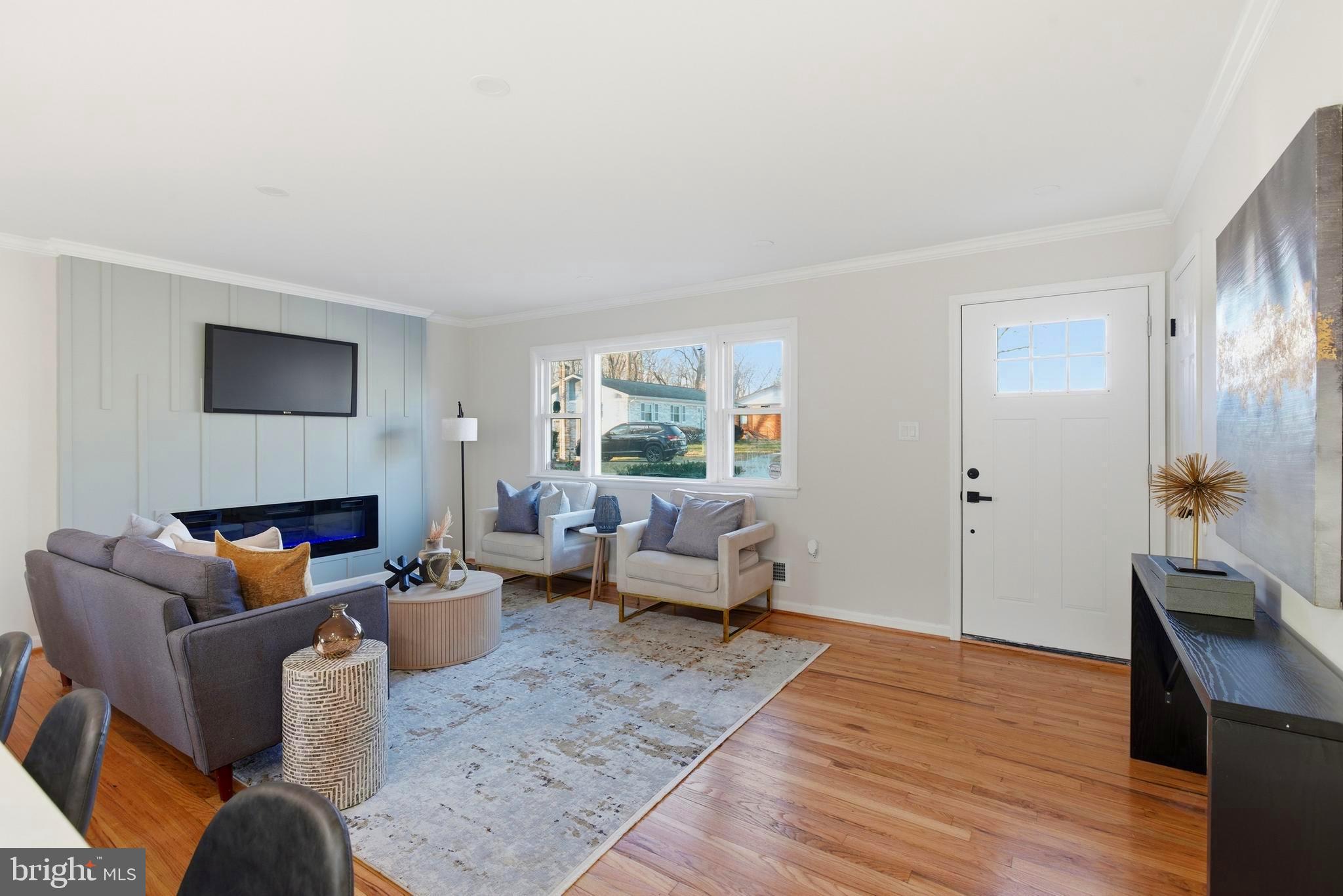 709 Quarry Avenue Capitol Heights, MD 20743 - Photo 9 of 43 a living room with furniture and a fireplace