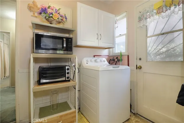 a utility room with washer and dryer
