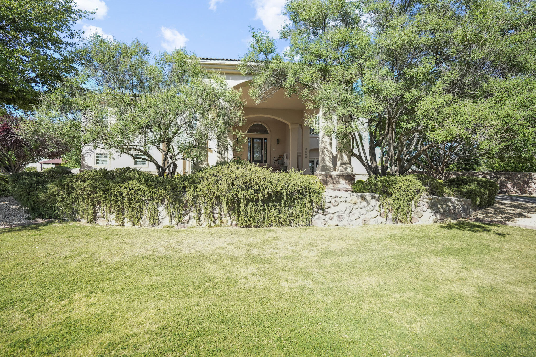 5500 Rancho Sereno Place El Paso, TX 79932 - Photo 1 of 1 a view of a yard with an trees