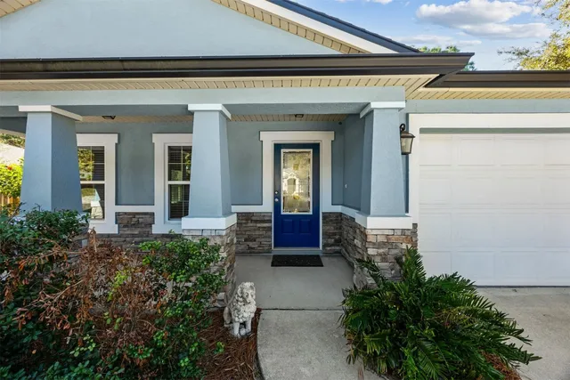 a front view of house with outdoor seating