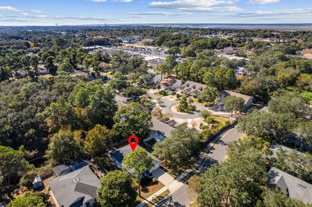 an aerial view of a houses with a yard