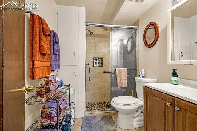 a bathroom with a toilet a sink and a shower