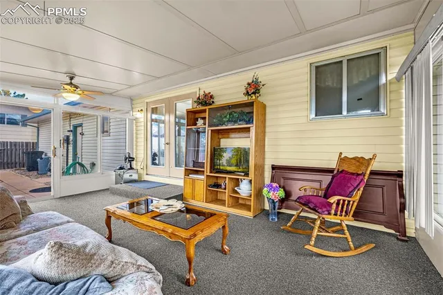 a backyard of a house with table and chairs