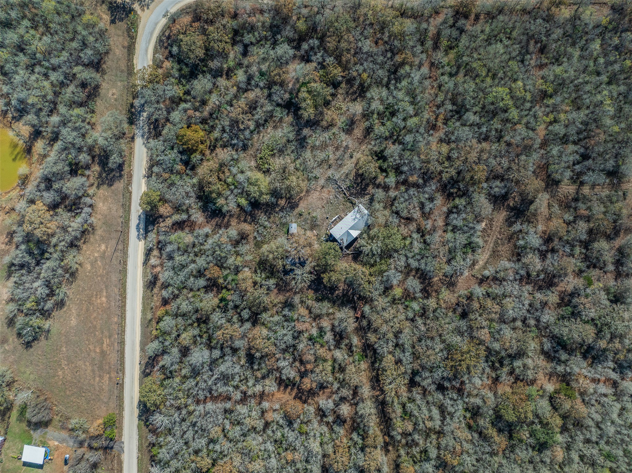 840 Bugtussle Lane Luling, TX 78648 - Photo 4 of 12 a view of a house with a dry yard