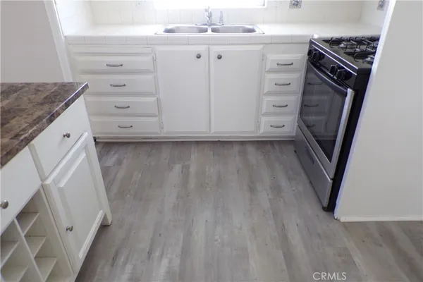 a kitchen with a sink and a stove