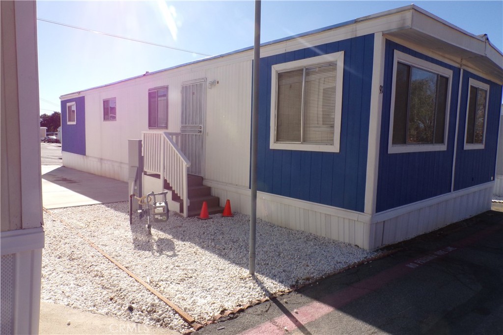 12710 3rd Street, Unit 91 Yucaipa, CA 92399 - Photo 2 of 21 a view of a hallway with the front door