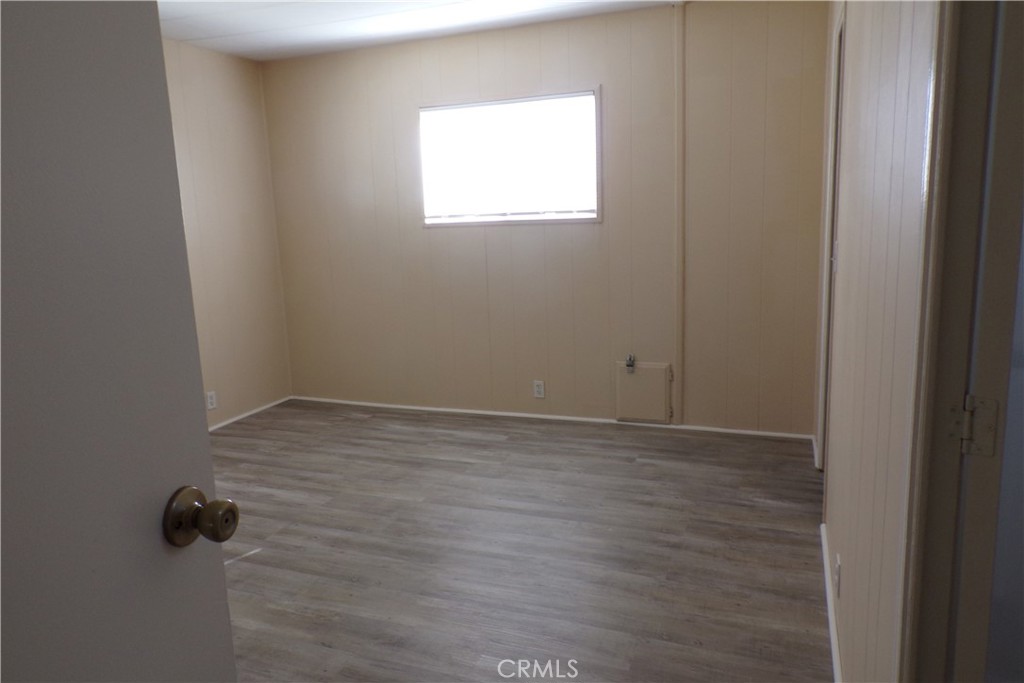 12710 3rd Street, Unit 91 Yucaipa, CA 92399 - Photo 9 of 21 a view of an empty room with a window