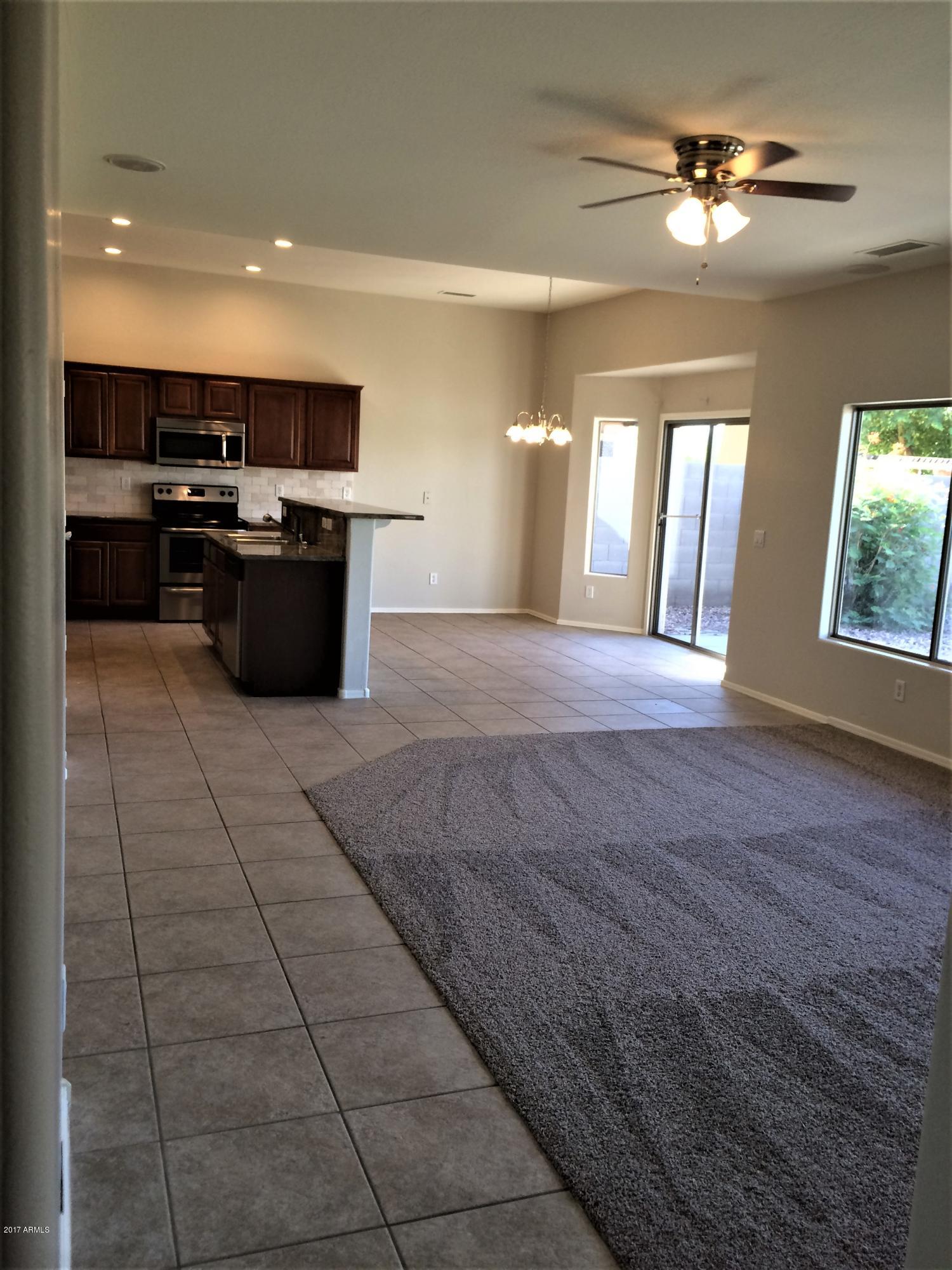 5533 West Pecan Road Laveen, AZ 85339 - Photo 3 of 38 Tile and New Carpet in Eat In Kitchen
