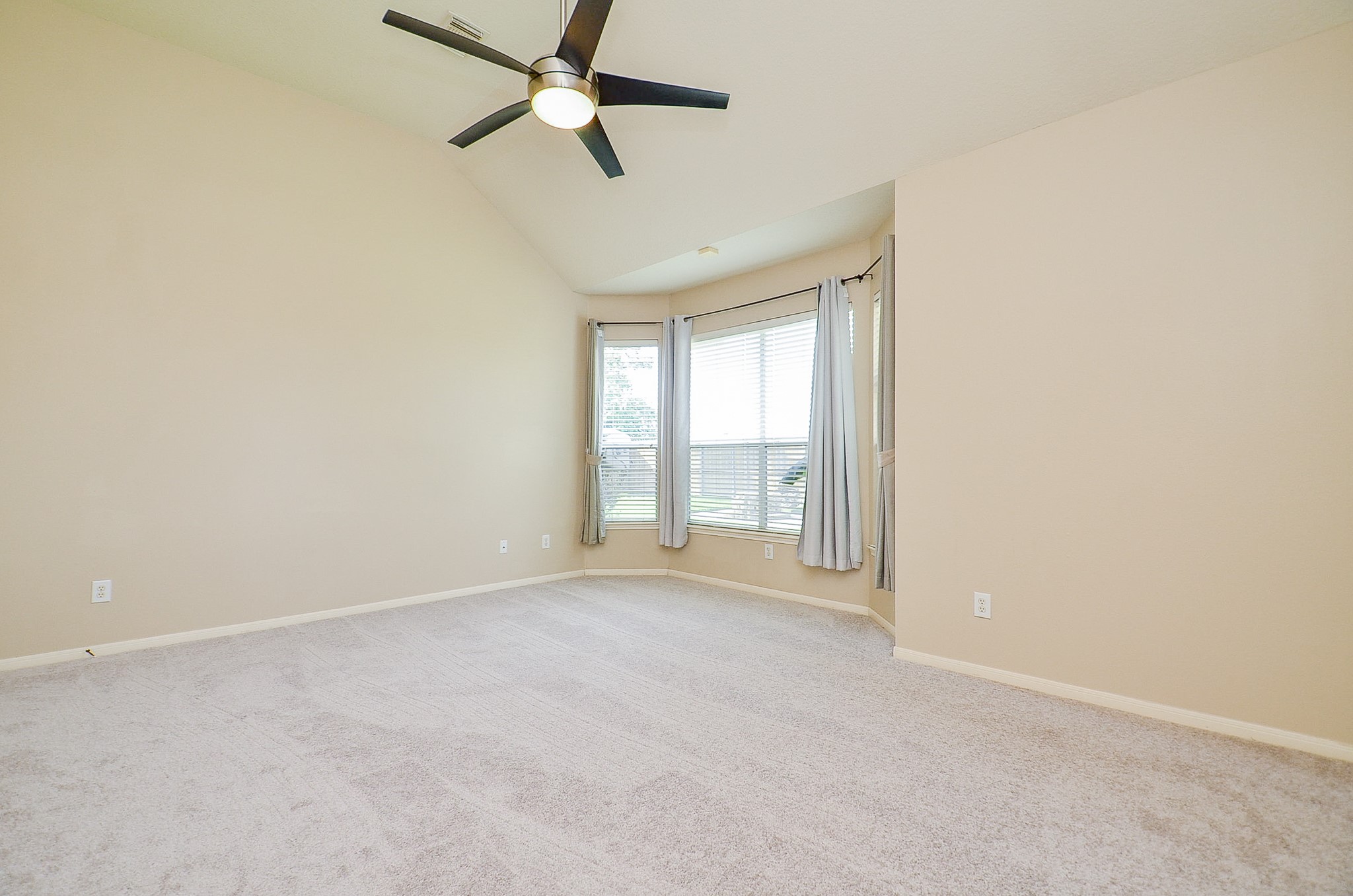 1222 Ragsdale Lane Katy, TX 77494 - Photo 16 of 31 New carpeting 7/25 in the primary bedroom. Neutral tones, updated and sleek ceiling fan and the coveted bay window. Great wall space.
