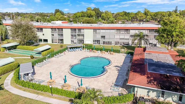 an aerial view of a house with outdoor space patio and swimming pool