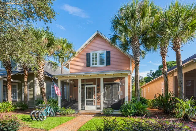 a front view of a house with a yard and porch
