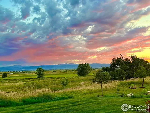 a view of a lake with a yard