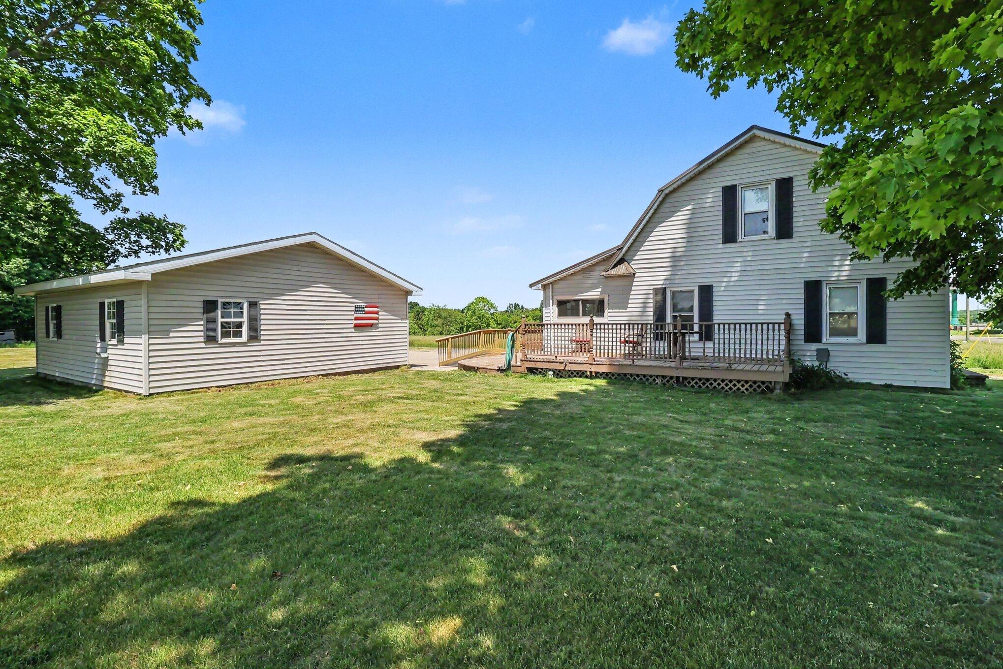 4559 South Maple Island Road Hesperia, MI 49421 - Photo 30 of 40 Back yard with deck
