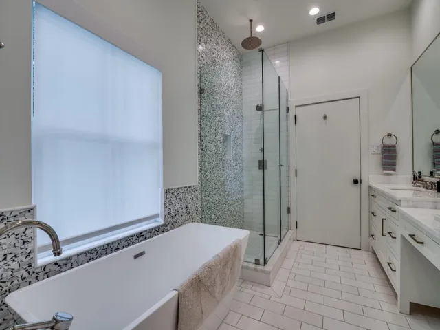 a bathroom with a double vanity sink and a mirror