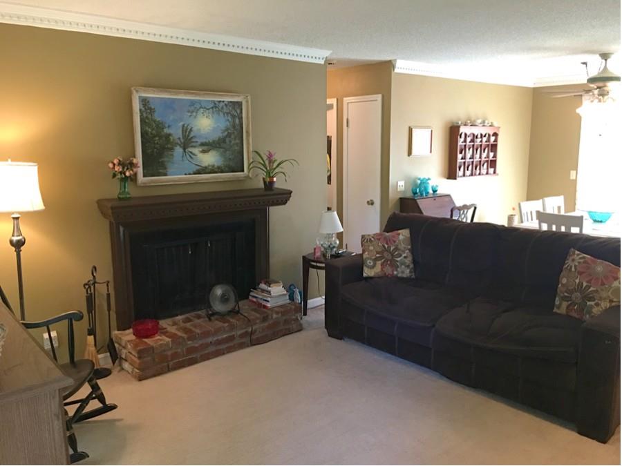 1008 Jacksons Valley Road Hermitage, TN 37076 - Photo 3 of 22 a living room with furniture and a fireplace