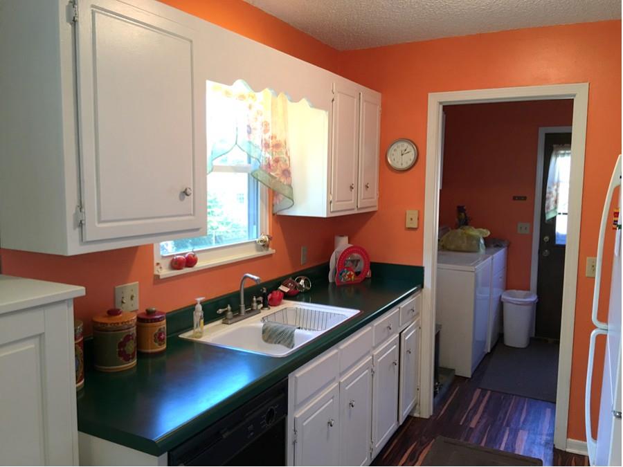 1008 Jacksons Valley Road Hermitage, TN 37076 - Photo 7 of 22 a kitchen with a sink cabinets and a window