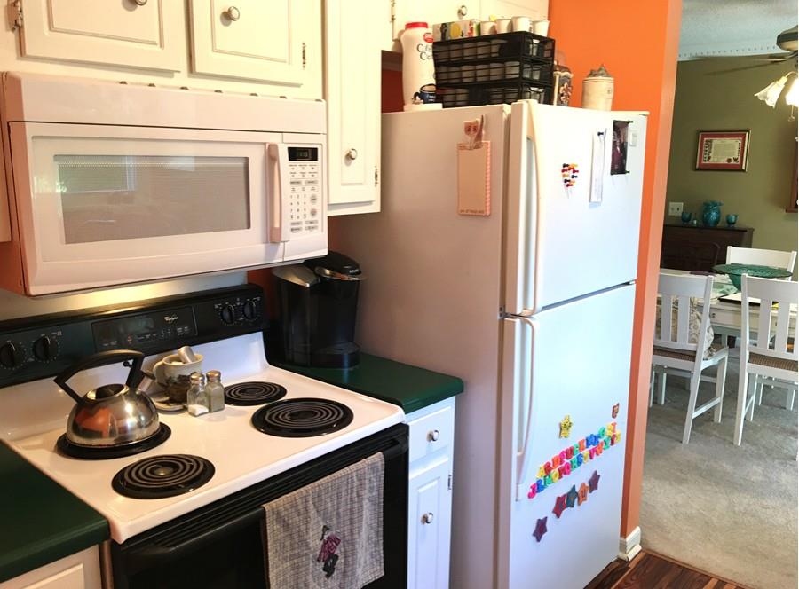 1008 Jacksons Valley Road Hermitage, TN 37076 - Photo 9 of 22 a kitchen with a refrigerator a stove and a sink