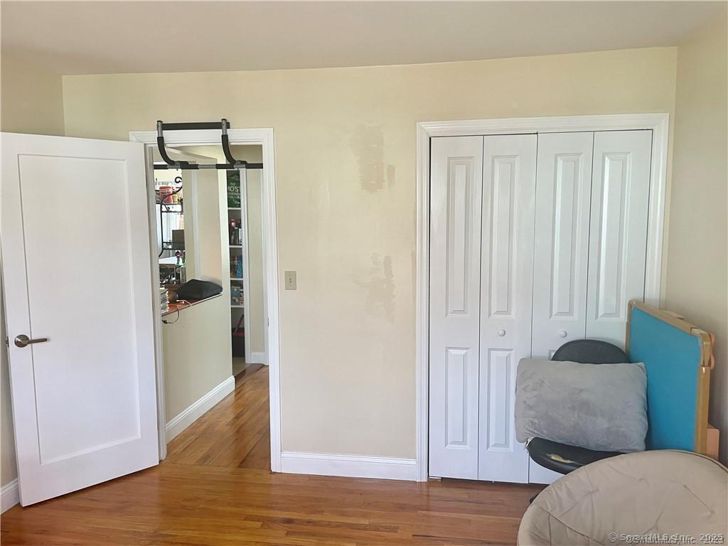 55 Oak Ridge Drive, Unit 60 New Haven, CT 06513 - Photo 15 of 16 a view of livingroom with furniture and wooden floor