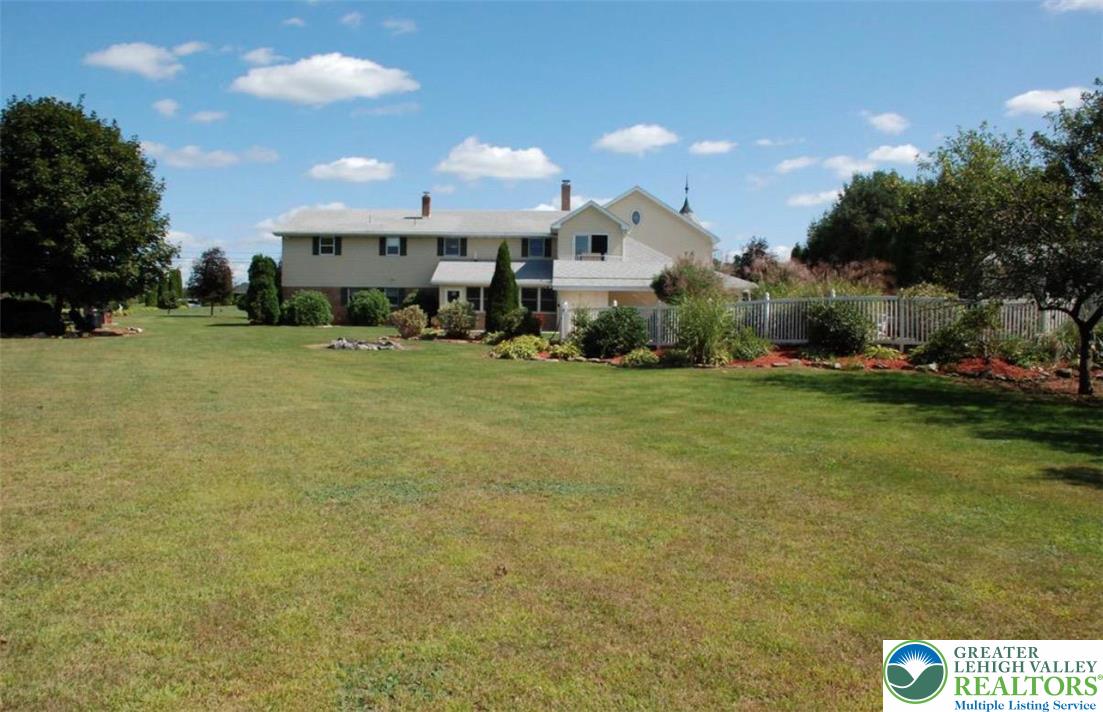 100 Hazelwood Road Lehighton, PA 18235 - Photo 3 of 31 a front view of a house with a yard and garage