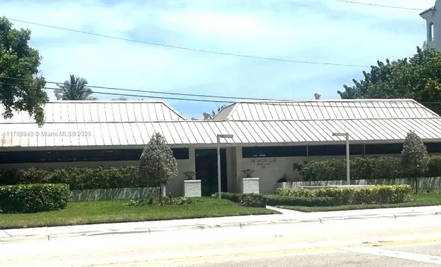a view of a swimming pool with a table and chairs