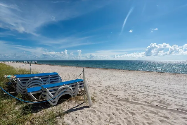 a view of a patio with table and chairs and potted plants