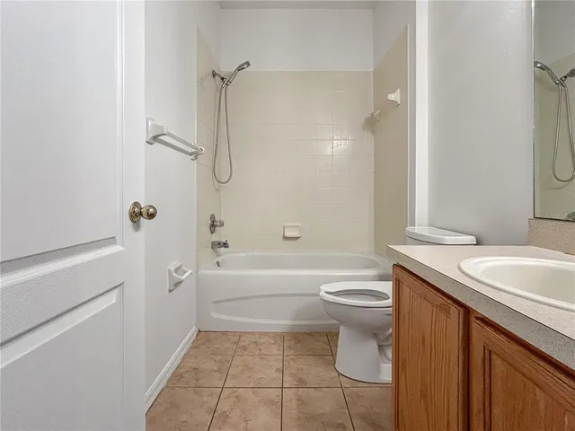 a bathroom with a bath tub with a shower