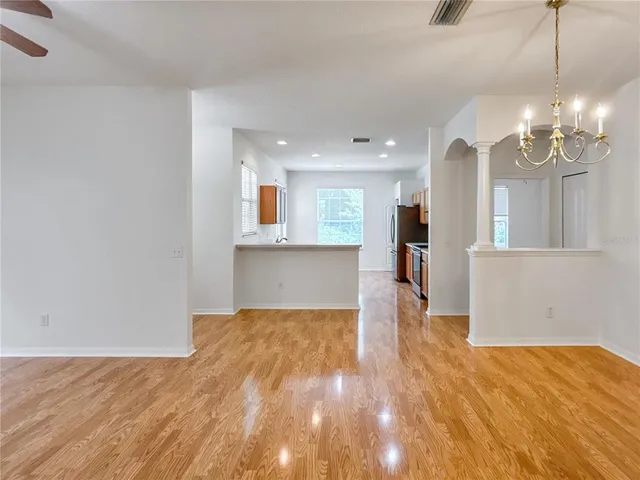a kitchen with stainless steel appliances a sink stove and cabinets