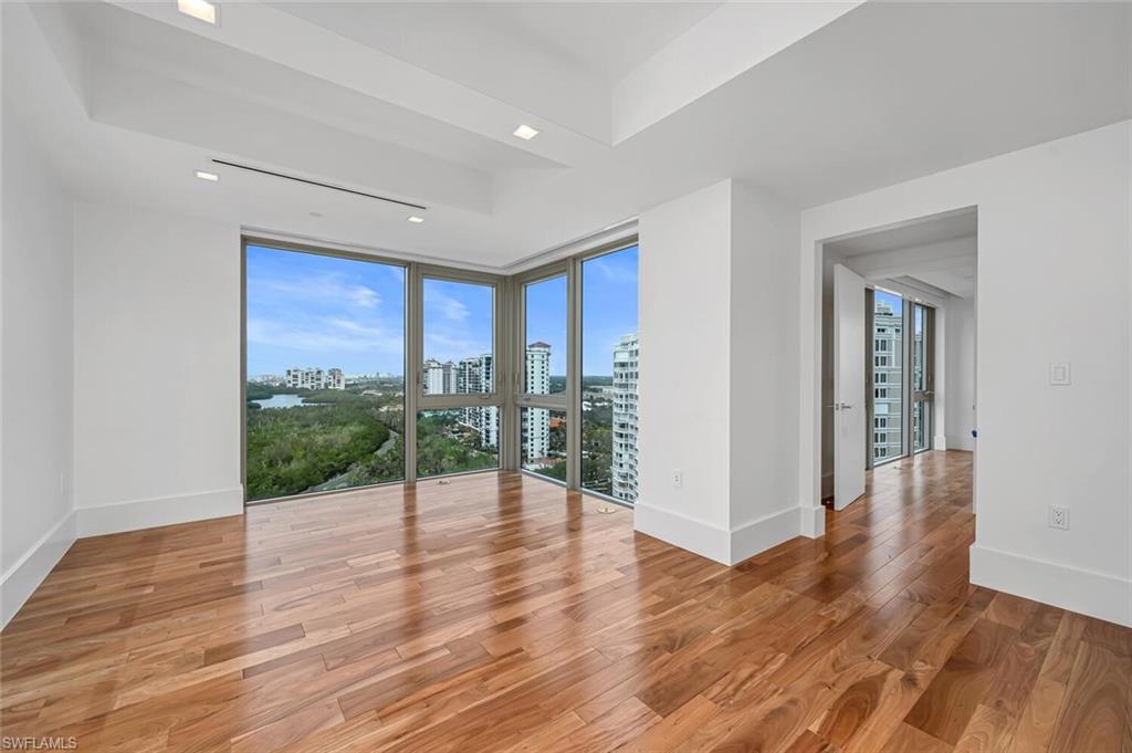 6897 Grenadier Boulevard, Unit 1804 Naples, FL 34108 - Photo 14 of 30 a view of an entryway with wooden floor