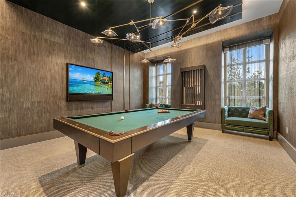 6897 Grenadier Boulevard, Unit 1804 Naples, FL 34108 - Photo 23 of 30 a room with pool table and flat screen tv
