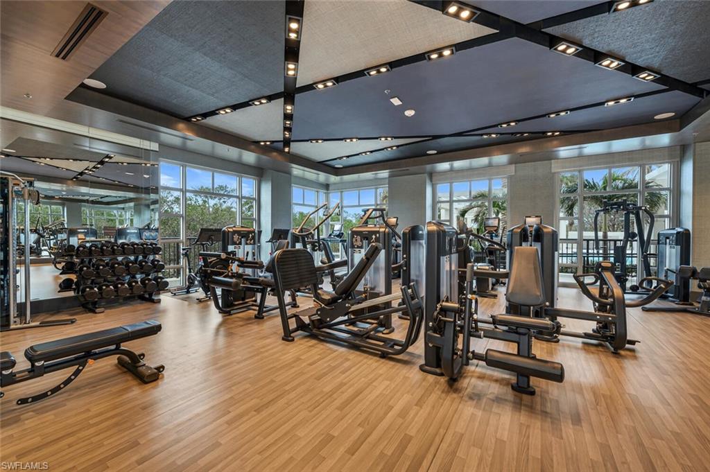 6897 Grenadier Boulevard, Unit 1804 Naples, FL 34108 - Photo 24 of 30 a view of a room with gym equipment