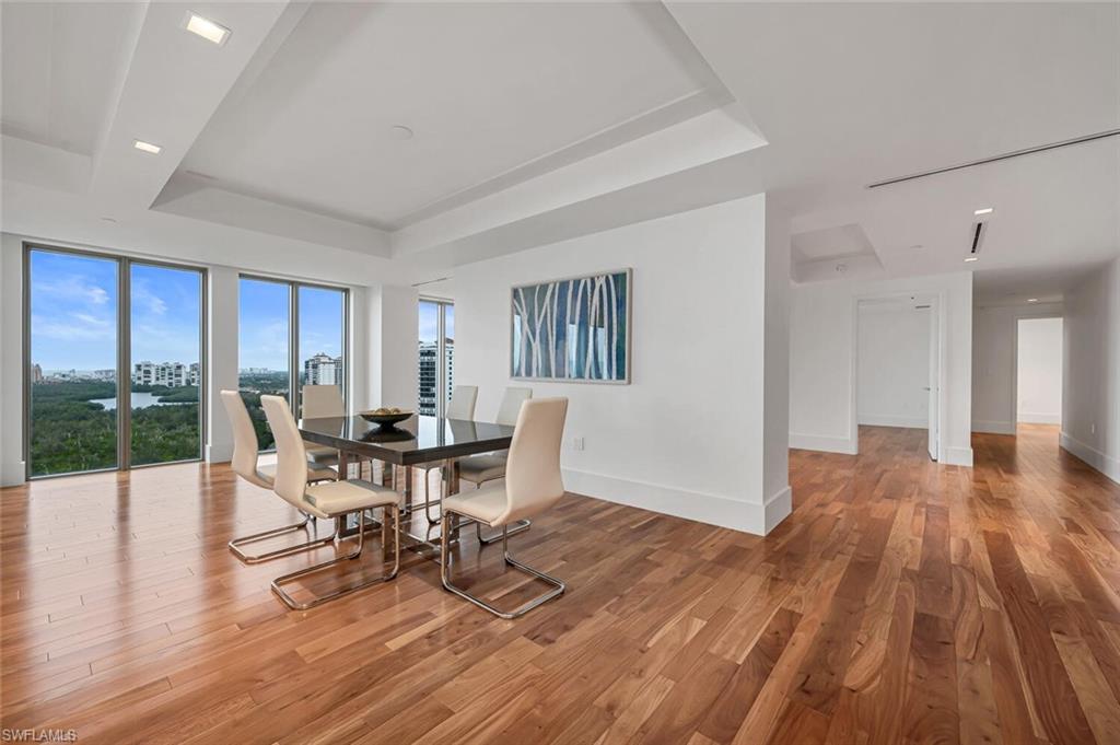 6897 Grenadier Boulevard, Unit 1804 Naples, FL 34108 - Photo 3 of 30 a work room with furniture wooden floor and windows