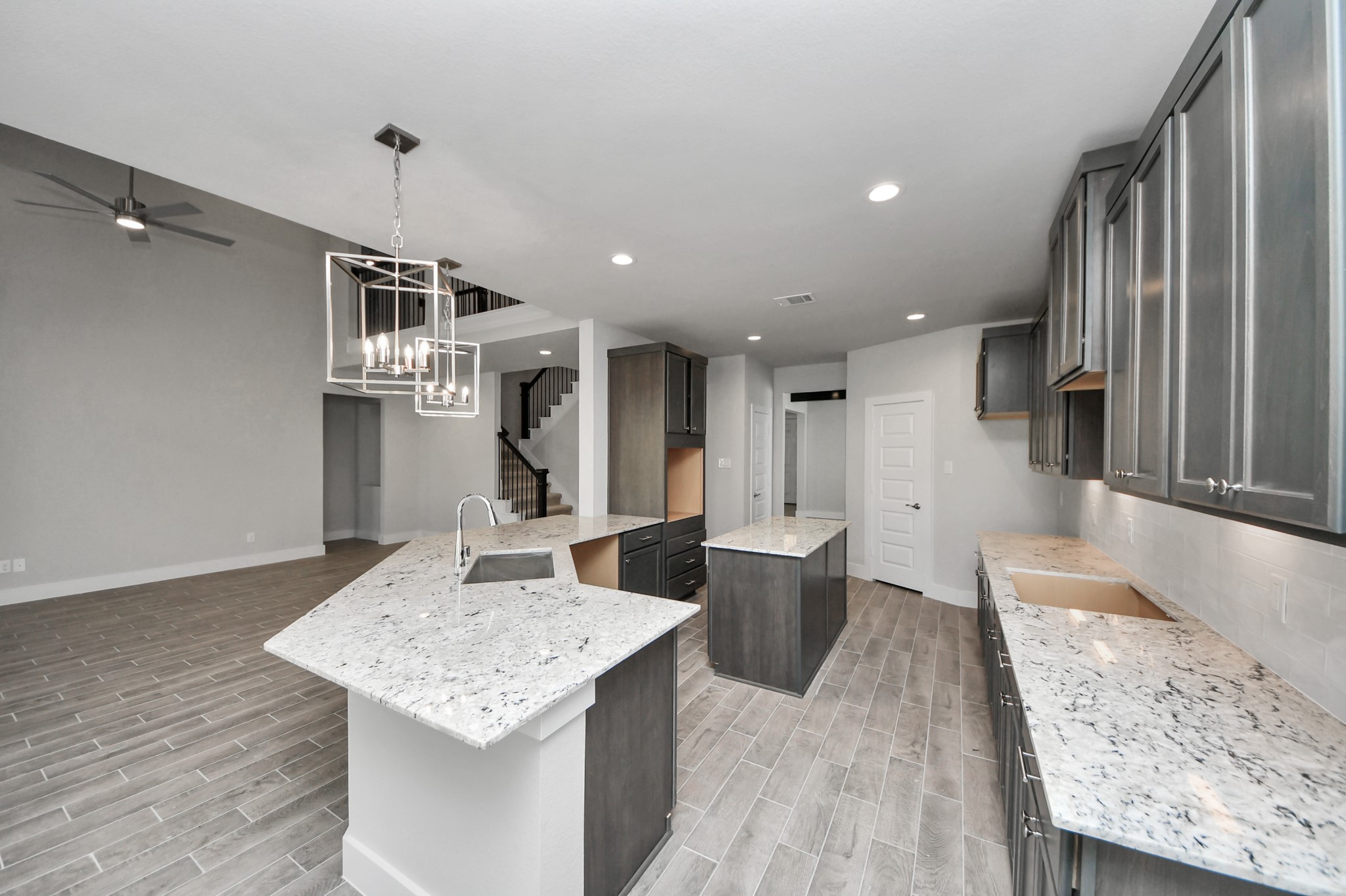 3110 Native Spg Drive Spring, TX 77373 - Photo 11 of 34 All of this overlooks your expansive family room, creating a perfect space for culinary delights and family gatherings. Sample photo of completed home with similar floor plan. Actual colors and selections may vary.
