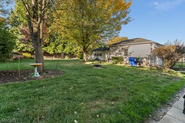 a view of a patio with table and chairs