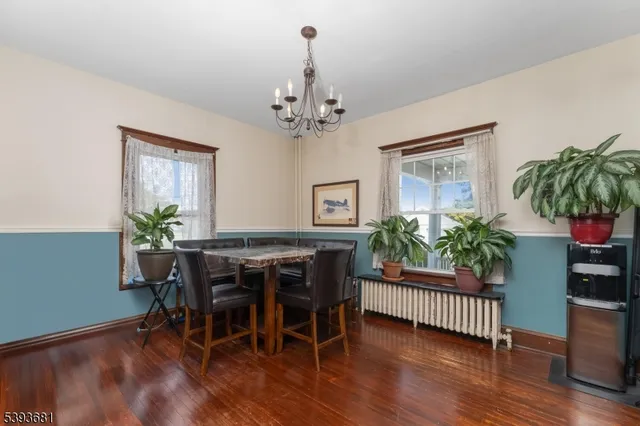 a bedroom with a bed chair and a window
