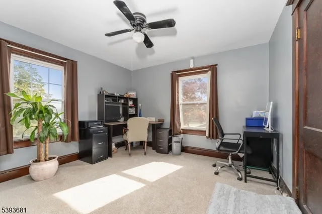 a spacious bedroom with a bed and window