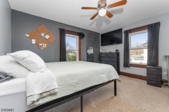 a bedroom with a bed and a chair