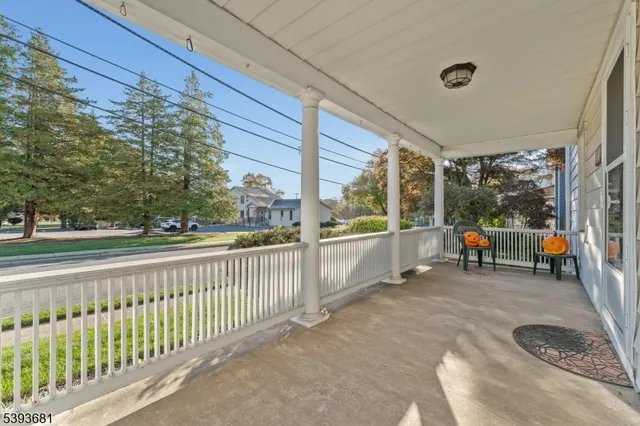 a view of a house with backyard porch and sitting area