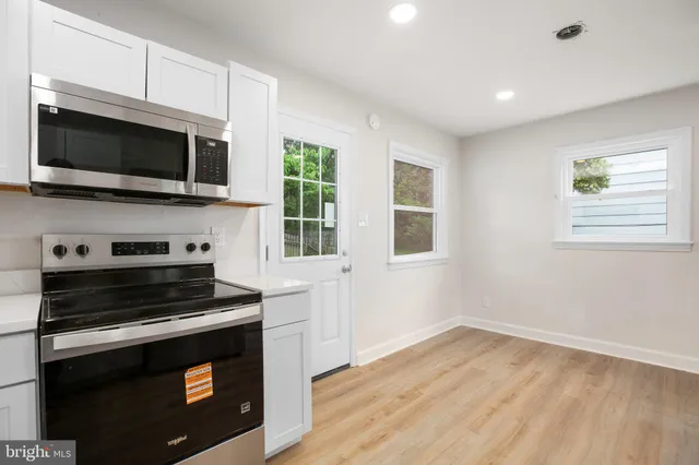 a kitchen with a stove and a microwave