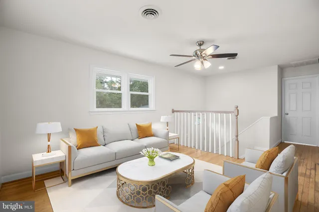 a living room with furniture and a table